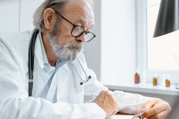 Portrait of an older person wearing glasses.